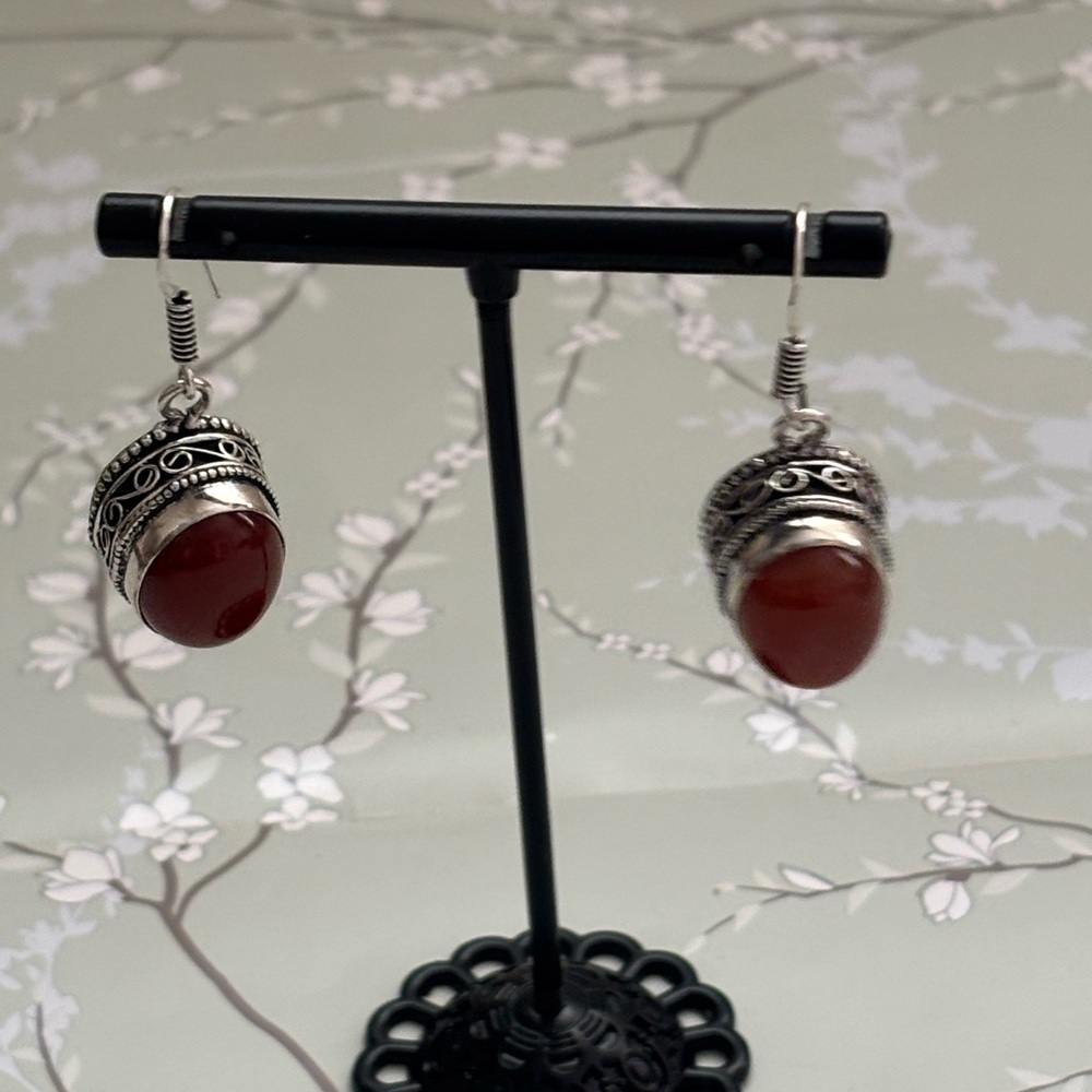 Carved Silver Drop Earrings with Red Stone
